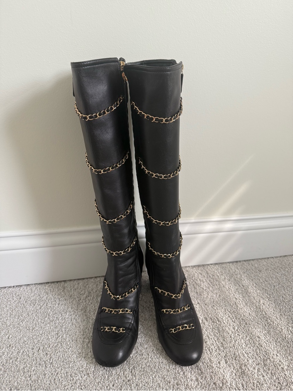 CHANEL Black knee-high lambskin leather boots